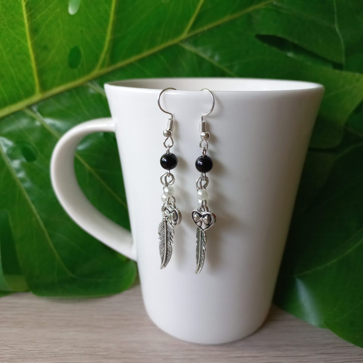 minđuše pero sa srcem